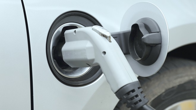 charging cable attached to electric car