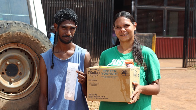 rosie and denis with groceries and receipt