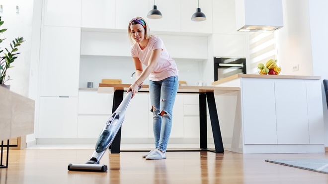 woman using easy to use vacuum