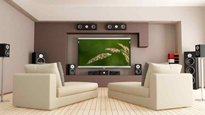 a lounge room with a big tv and home theatre system