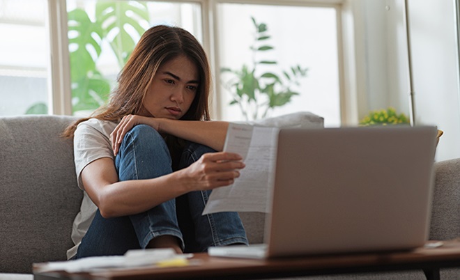 concerned person checking bank statement