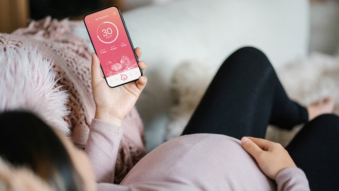 woman using a pregnancy app