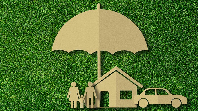 family_standing_under_umbrella_insurance
