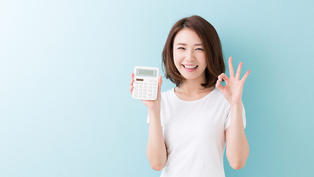 younger woman with calculator budget