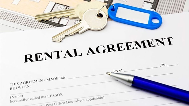 Rental agreement paper with pen and keys