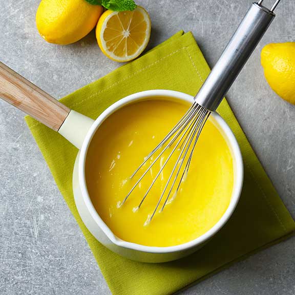 sauce pan with lemon curd cooking sq