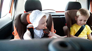 baby girl and little boy in car seats