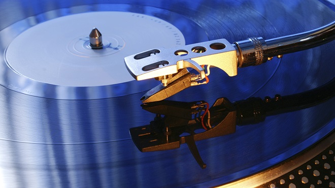 closeup of turntable stylus playing a record
