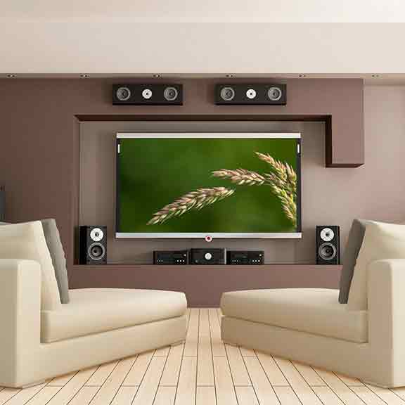 a lounge room with a big tv and home theatre system square
