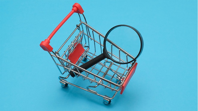 shopping trolley and magnifying glass